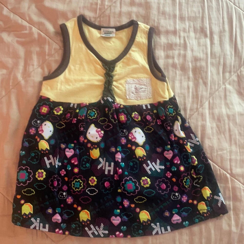 5-month girl’s sleeveless dress - top yellow & bottom colorful